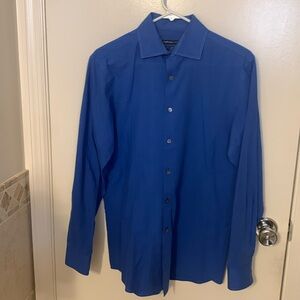 Men’s blue Van Heusen button down dress shirt.